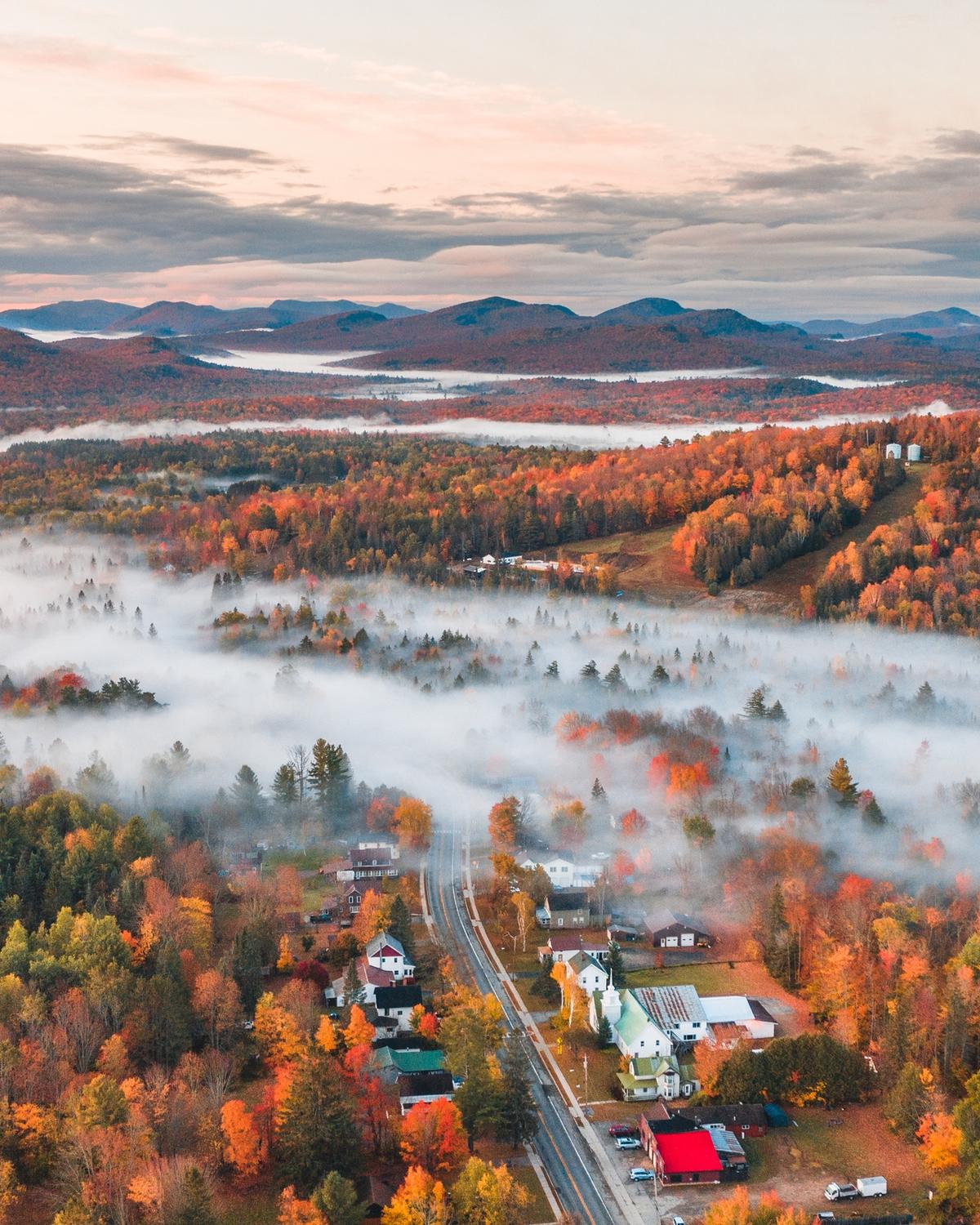 Low fog over a city in the Adirondacks in the Autumn